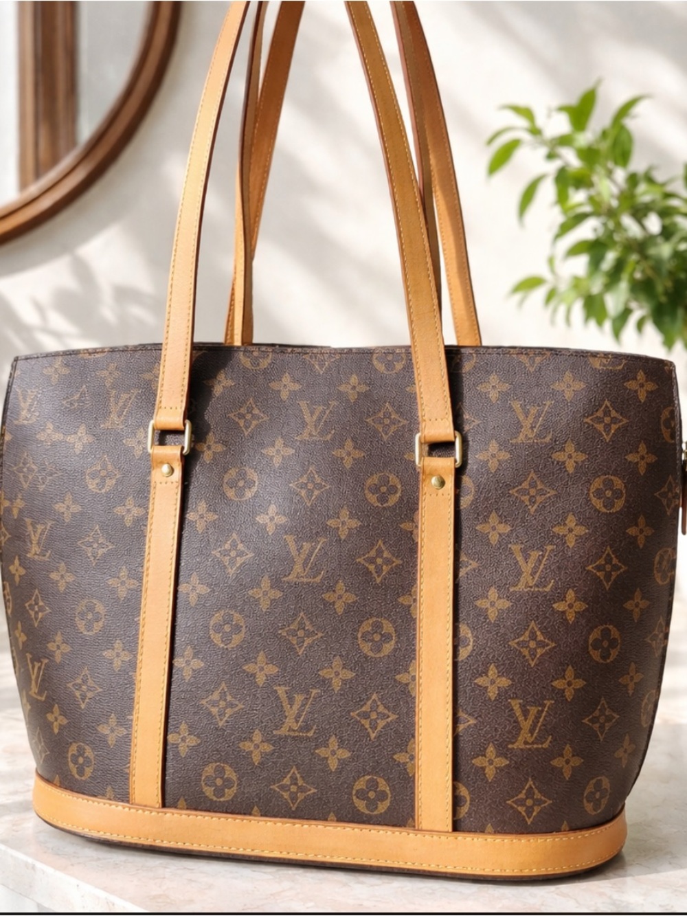 - Authentic Louis Vuitton BABYLONE Tote Shoulder Bag.